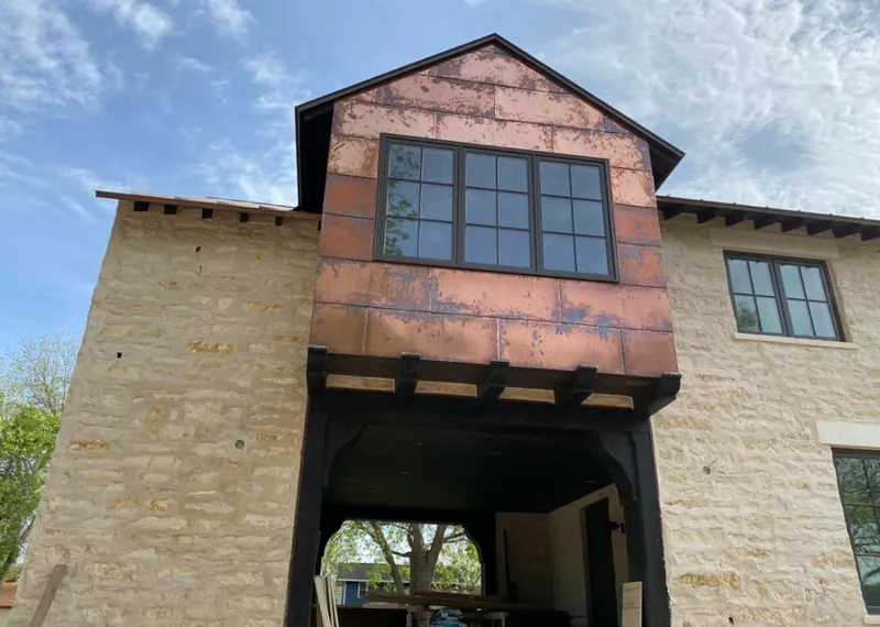 Copper metal panel facade on a stone building for Metal Roof Coating in Crestline